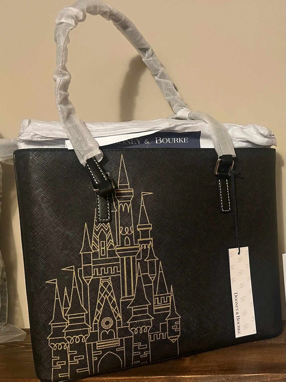 Dooney & Bourke Black Tote with Gold Castle Motif